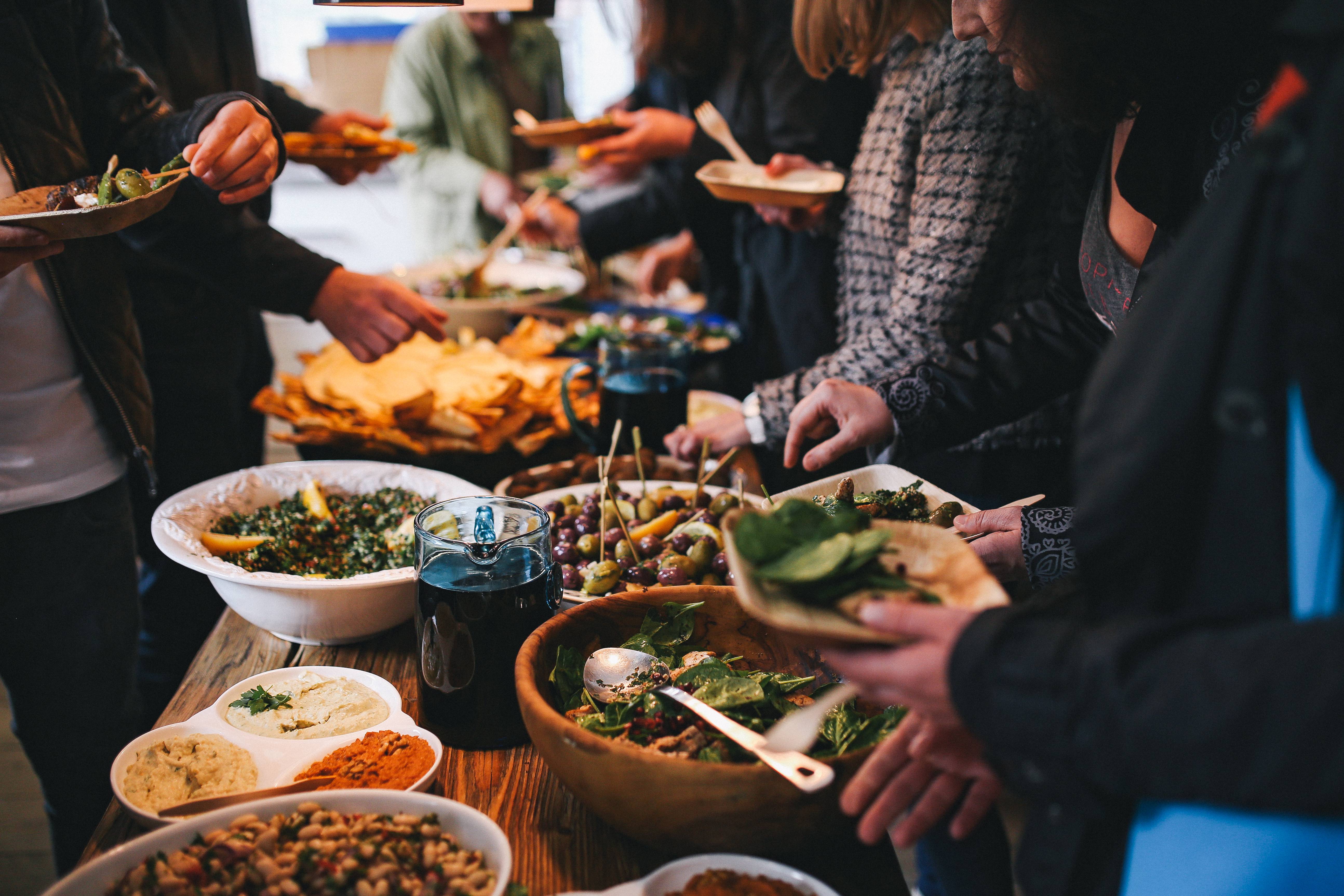 Courtesy of https://www.foodiesfeed.com/free-food-photo/people-feasting-on-healthy-salad-buffet/